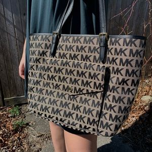 Beige and black Michael Kors bag